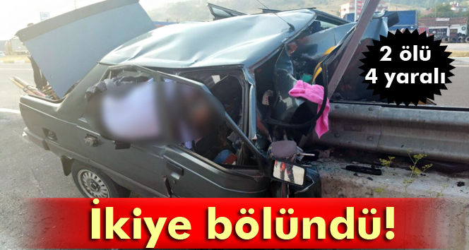 Bariyerlere çarpan otomobil ikiye bölündü